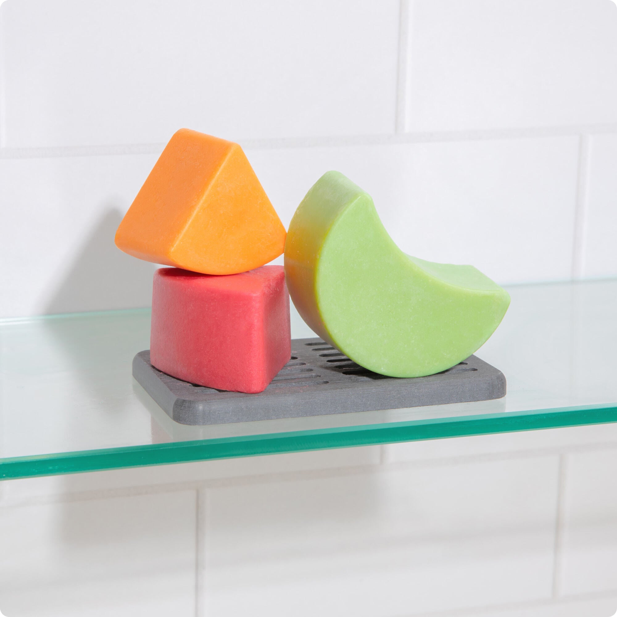 Shampoo and conditioner bars on storage tray
